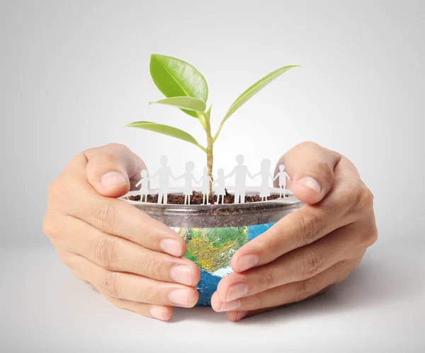 Holding a glowing earth globe in his hands — Stock Photo, Image