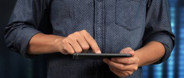 Man holding smartphone device  holding smartphone device and touching screen