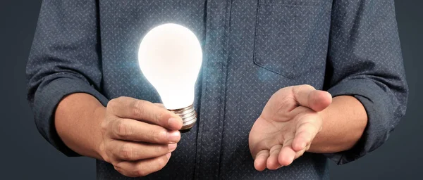 Humans hold light bulbs in hand innovative technology and creativity. creative idea light bulbs
