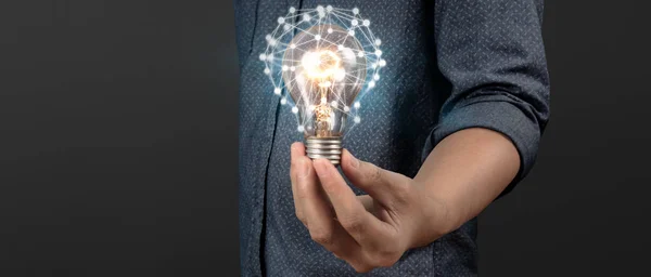 Humans hold light bulbs in hand innovative technology and creativity. creative idea light bulbs