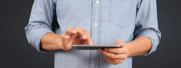 Man holding smartphone in hand device and touching screen