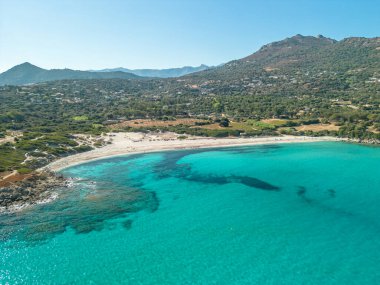 Aerial view of the clear turquoise Mediterranean sea at Bodri beach in the Balagne region of Corsica