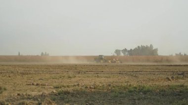 8K 7680x4320 4320p.Land levelling is a measure used in surface irrigation, such as basin and furrow irrigation. Tractor and laser farmland leveling control system. Field and land leveller. Land leveling machine. Aerial soil clay land earth