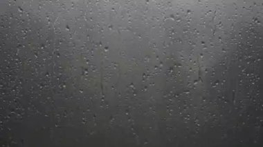8K 4320p 7680x4320.Water drops of rain on wet window glass surface. Transparent blobs of rains on glass. Drop randomly sliding on windows. Will mix decently if blend mode set to luminosity. Aqua romantic drip emotional blob liquid slide slip weather