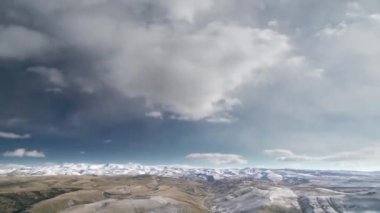 8K 60p 7680x4320 4320p.First snow on standard hill in winter.Mountain cloud clouds weather time lapse snowy snows thin arid vegetation infertile xeric treeless dried dry drought dehydrated waterless steppe mount mountainous higher terrain geography 