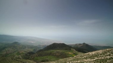 8K 7680X4320.Humid and moist weather.Fine dust particles in the air.High moisture density in hot sky.Mountains around the city by the sea.Time lapse in cloudless day.Hatay Antakya Turkey iskenderun.