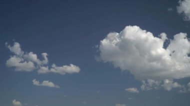 Cinematic 8K 7680x4320.Partly cloudy in sunny day.Cumulus cloudy sky in summer.Mixed clusters cluster time lapse small single clear blue air weather simple bare clusters cluster cottony clump stack 8K