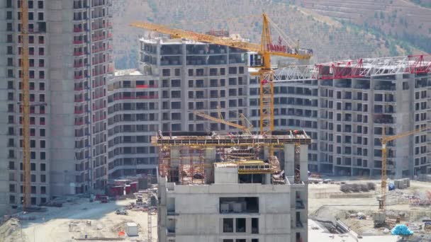 Cinematic 7680X4320 Cranes Construction Workers Working Major Builders Building Site — Stockvideo