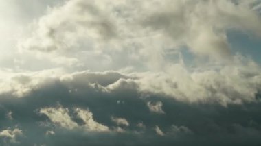 8K 4320P.Cloud movements before the storm.Variable mix dark clouds time-lapse.Partial cloud cover cloudage.Different cloud layers in the sky.Storm clouds are dispersing.Weather meteorlogy air evening.
