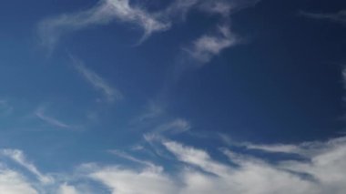 8K 7680x4320.Only cirrus clouds in the blue sky. Fibrous clouds are similar to cirrus uncinus, commonly known as mares tails however, fibratus cloud do not have tufts or hooks at the end.time lapse, cinematic, background, landscape, view, nature.
