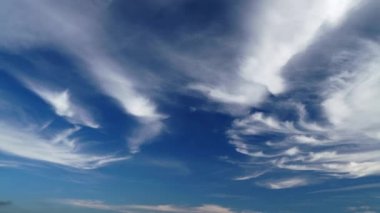 8K 7680x4320.Only cirrus clouds in the blue sky. Fibrous clouds are similar to cirrus uncinus, commonly known as mares tails however, fibratus cloud do not have tufts or hooks at the end.