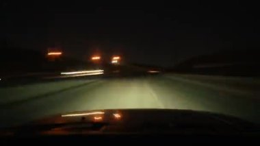 8K 7680x4320 4320p.Night lights and traffic on the city roads.Slow shutter from inside cockpit.Car is moving in dark at night.Vehicles headlights.Bokeh effect and city lights.Vehicle non stop pov streaking streaky look transit ride drive energetic 
