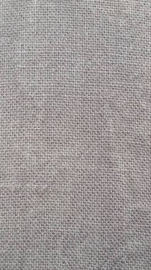 Çuval bezi desenli bir arka plan. Gri Hess çuval bezi dokusu arka plan olarak kullanışlıdır.