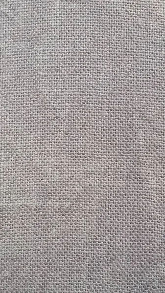 Sfondo con una trama di iuta. Grey Hessian texture iuta è utile come sfondo. — Foto Stock