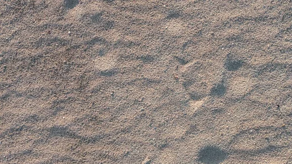 Пісок висушеного дна річки. Розмите зображення піщаного візерунка . — стокове фото