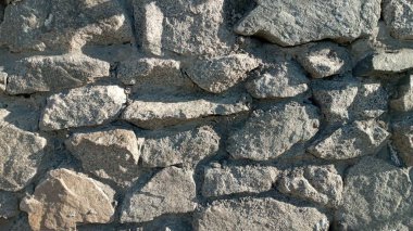 Taş duvarın bir parçası, arka plan ya da doku için. Taş bir duvarın dokusu. Arkaplan ya da doku olarak taş duvar.