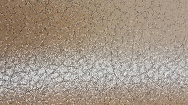 新米米色皮革背景特写。人造皮革的米色光泽结构. — 图库照片