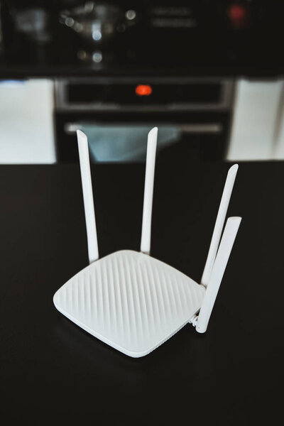Side view of a modern WI-FI router for home usage with 4 antennas