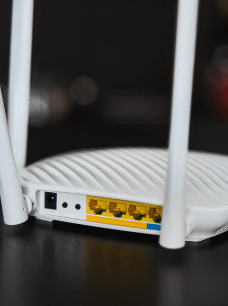Side view of a modern WI-FI router for home usage with 4 antennas