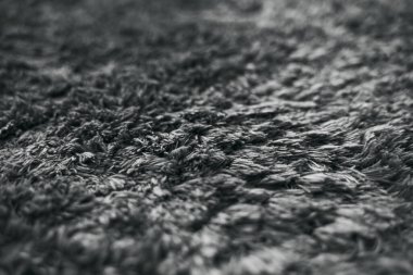 Grey modern floor rug texture. Generic long pile carpet for indoor use.