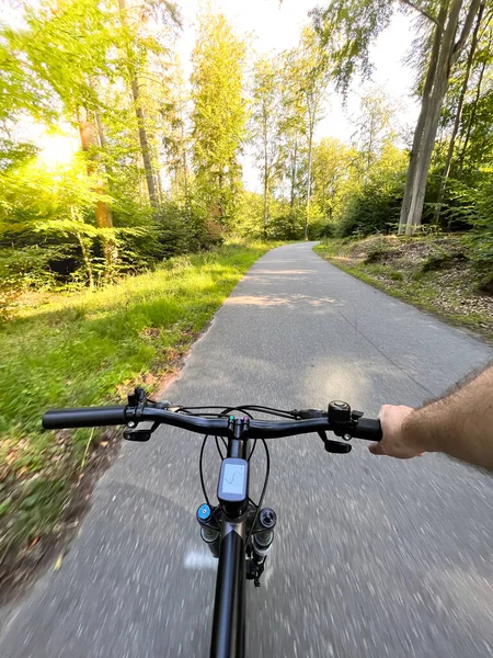 Bike handlebar first person view. Concept of outdoor riding mountain bike.