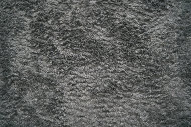 Grey modern floor rug texture. Generic long pile carpet for indoor use.
