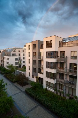 Contemporary resident complex in Europe during summer evening. Concept of happy living in the modern house. Owning a real estate concept.