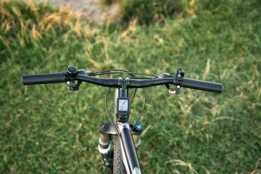 First person view bike handlebar. Outdoor bicycle riding concept.