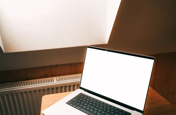 Modern portable computer mock-up. Blank screen for website or application placing. Isolated laptop indoors without people.