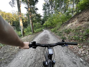 Bike handlebar first person view. Concept of outdoor riding mountain bike.