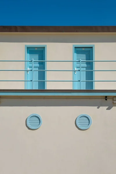 Bright Blue Doors Louvered Windows Stucco Building — Stock Photo, Image