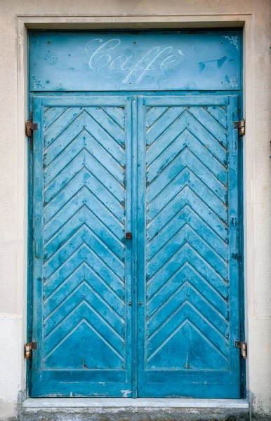 Blue shuttered cafe window in Rome, Italy.