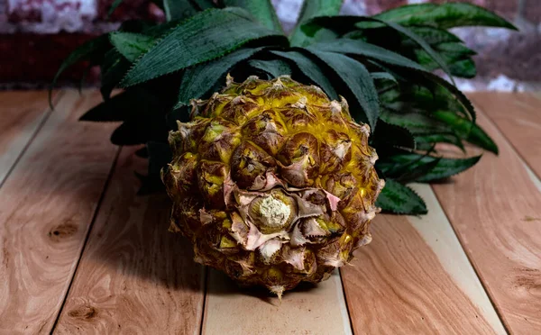 One Whole Pineapple Lies Light Boards Background Brick Wall Close — Stock Photo, Image