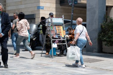 ATHENS, GREECE - MAY 14, 2022: A street vendor of freshly baked corn is waiting for buyers to arrive in Athens.