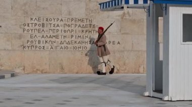 ATHENS, GREECE - MAY 14, 2022: A marching soldier from the presidential guard Evzones in front of The Tomb of the Unknown soldier in Athens, Greece.