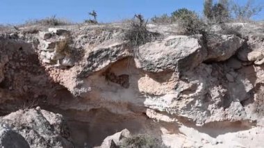 Entrances to caves in Beit Guvrin Maresha National Park in Israel. 4k video