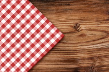 Tablecloth on wooden table background clipart