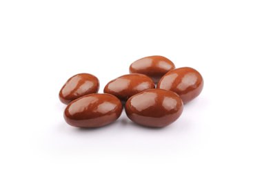 Dark brown dragee, in chocolate covered with clipping path clipart