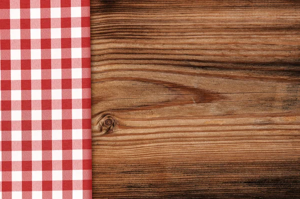 Toalha de mesa em fundo de mesa de madeira — Fotografia de Stock