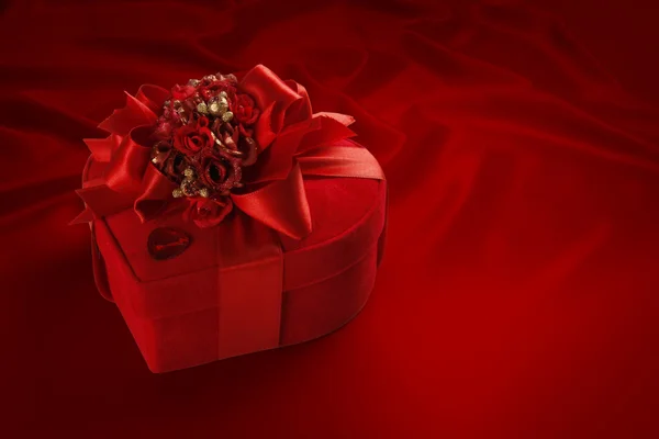 Valentine's Day and Christmas chocolate box (on red background). — Stock Photo, Image