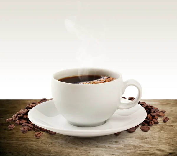 Coffee cup and saucer on a wooden table (clipping path). — Stock Photo, Image