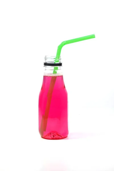 Reddish Pink Colored Water Packaged Clear Plastic Bottle Green Drinking — 스톡 사진