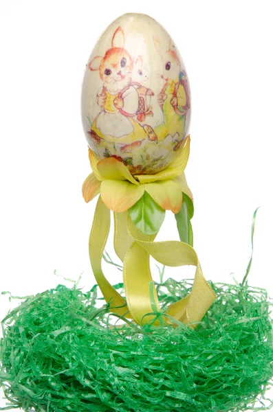 Painted easter egg on a green nest — Stock Photo, Image