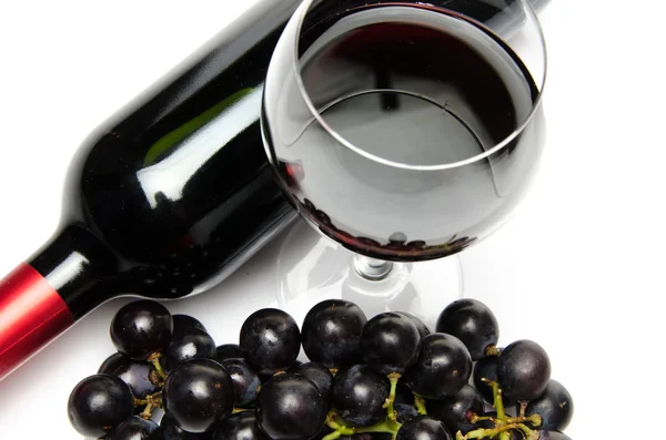 Bottle and glass of wine with black grapes — Stock Photo, Image