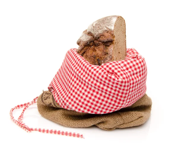 Een stukje van het brood in een zak — Stockfoto