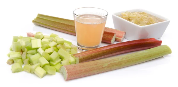 Juice and cooked rhubard with stalks and chopped rhubarb — Stock Photo, Image