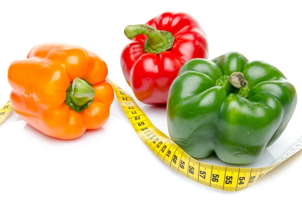Measuring tape with different peppers — Stock Photo, Image