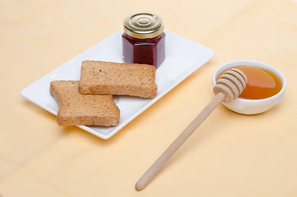 Composición de desayuno, miel, tostadas, mermelada —  Fotos de Stock