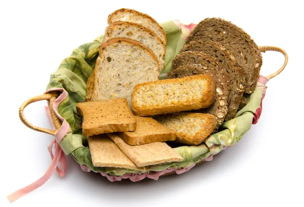 Different sorts of toasts in a basket — Stock Photo, Image