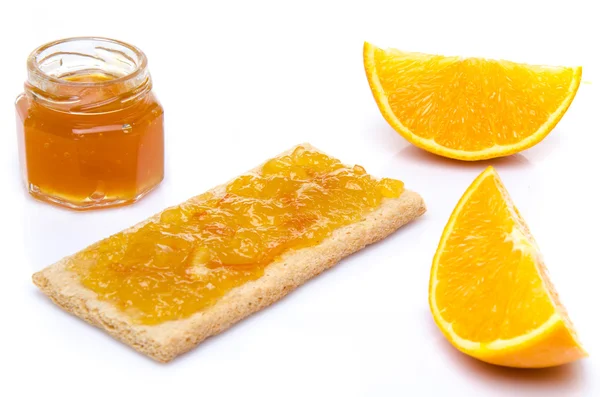 Orange, jam and a crisp toast — Stock Photo, Image